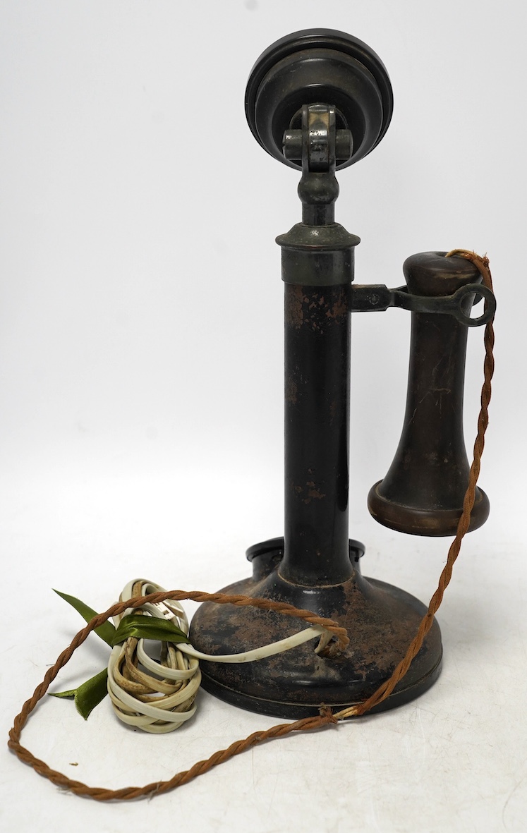 An early 20th century candlestick telephone, 31cm. Condition - fair